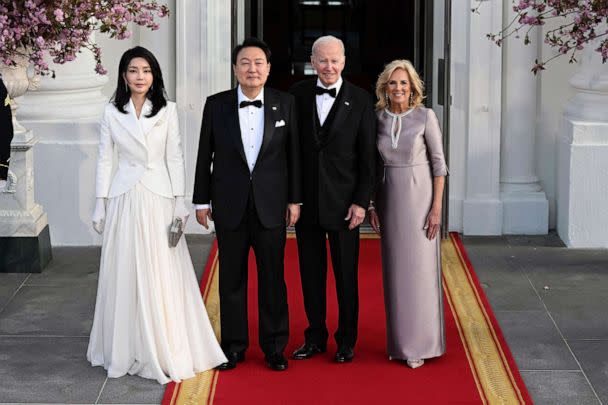 PHOTO: South Korean President Yoon Suk Yeol and his wife Kim Keon Hee stand with President Joe Biden first lady Jill Biden before a state dinner at the White House, April 26, 2023. (Jim Watson/AFP via Getty Images)