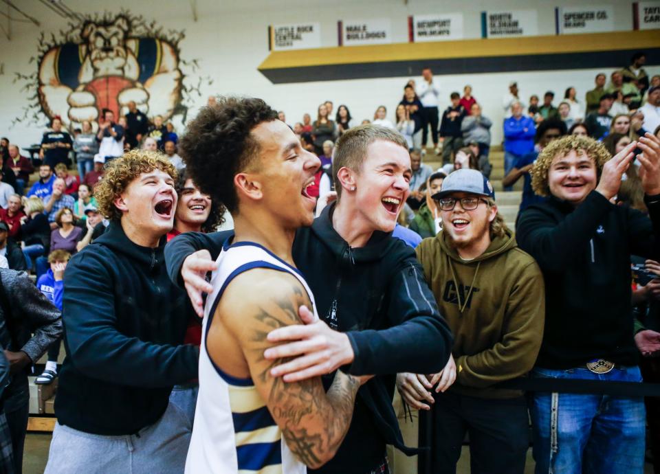 Fairdale students celebrate the Bulldogs' win with Fairdale's Cameron Croney (3) after the Bulldogs came back to defeat Spencer County 69-67 at Thursday's 2023 Chad Gardner Law King of the Bluegrass holiday basketball tournament at Fairdale High School. Dec. 21, 2023