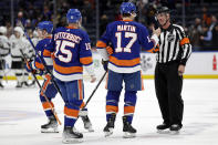 New York Islanders left wing Matt Martin (17) shakes hands with referee Dean Morton (36) after an NHL hockey game against the Los Angeles Kings, Thursday, Jan. 27, 2022, in Elmont, N.Y. (AP Photo/Adam Hunger)