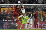 Juventus' Bremer, top, scores his side's first goal during the Serie A soccer match between Roma and Juventus, at Rome's Olympic Stadium, Sunday, May 5, 2024. (AP Photo/Andrew Medichini)