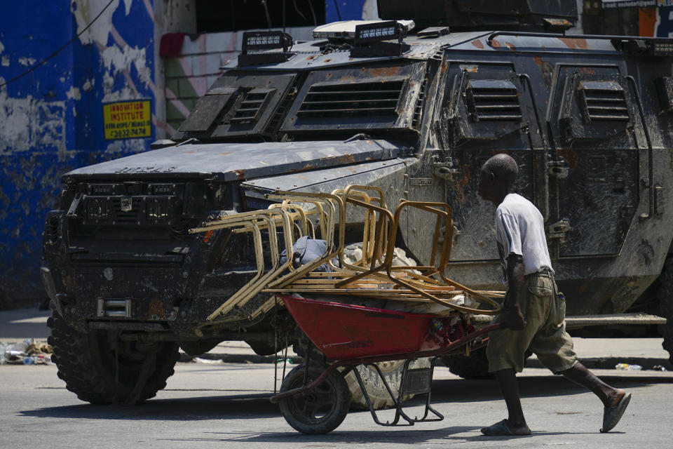 Police patrol in an armored vehicle in the Champ de Mars area of Port-au-Prince, Haiti, Wednesday, April 24, 2024. (AP Photo/Ramon Espinosa)