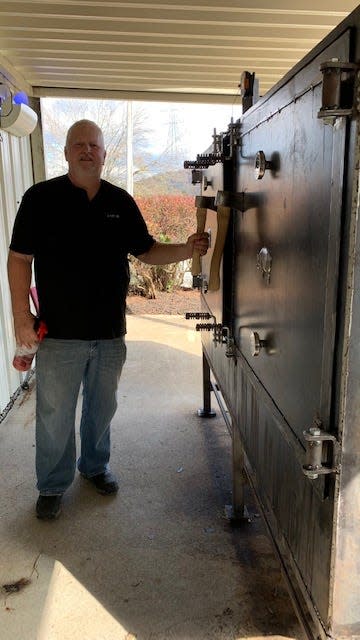 Chef Terry Hope with “Big Gurl,” Woody’s new smoker.