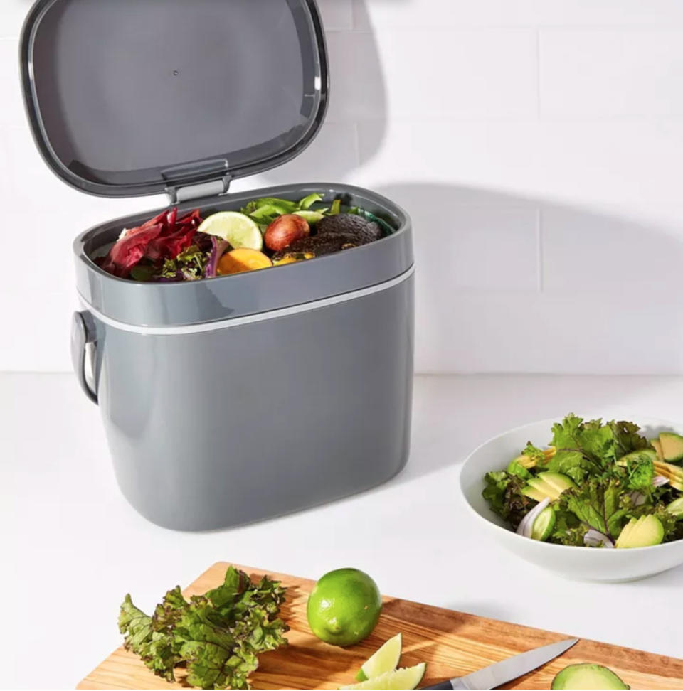 a plastic compost bin on a kitchen counter