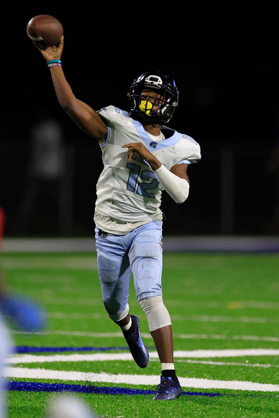 Ribault's Timothy Cole (12) throws a touchdown pass during the fourth quarter against Riverside in a November 2022 game.