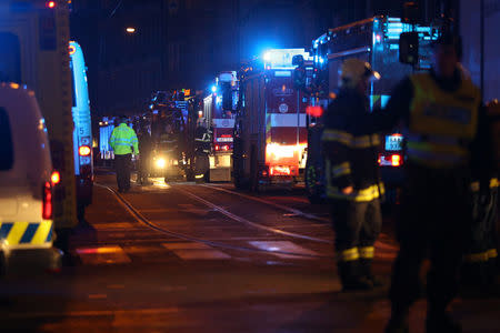 Firefighters work at the scene of a fire at a hotel in Prague, Czech Republic January 20, 2018. REUTERS/Milan Kammermayer