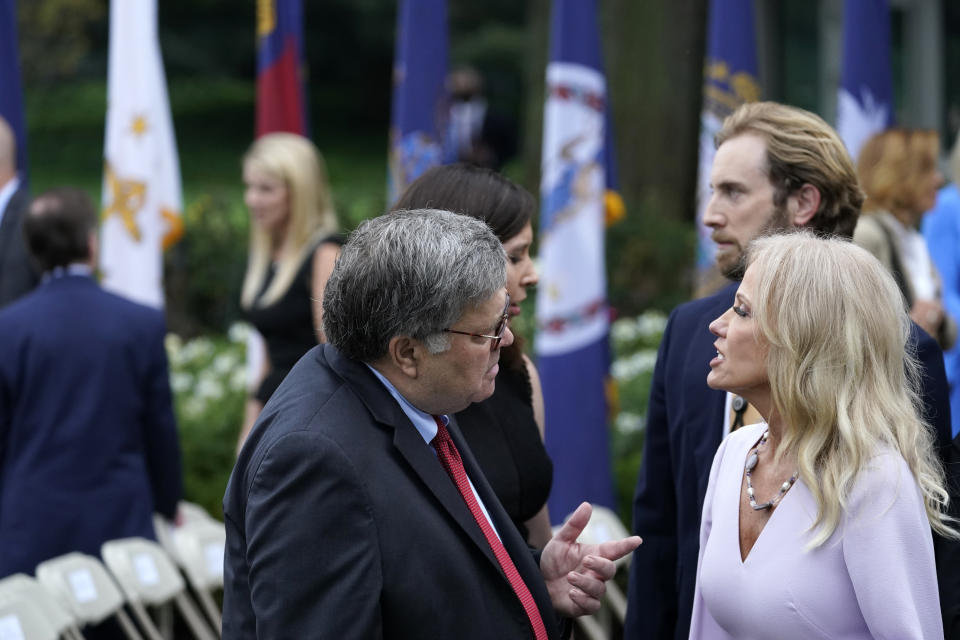 Attorney General William Barr speaks with Kellyanne Conway after President Donald Trump announced Judge Amy Coney Barrett as his nominee to the Supreme Court, in the Rose Garden at the White House, Saturday, Sept. 26, 2020, in Washington. (AP Photo/Alex Brandon)