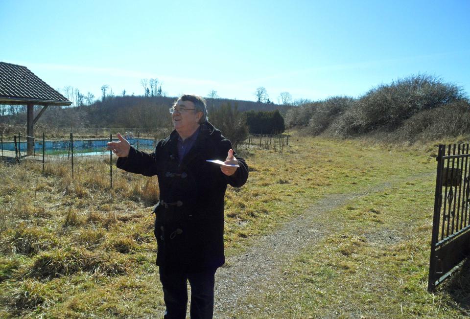 In this photo taken Tuesday Feb. 28, 2012, the mayor of Saint Nicolas Courbefy Bernard Guilhem gestures as he speaks in the French village of Saint Nicolas Courbefy, in Limousin, a region in central France. The entire hamlet is for sale and carried an asking price of just euro 300,000 ($440,000), the cost of a studio apartment in Paris. (AP Photo/Sarah DiLorenzo)