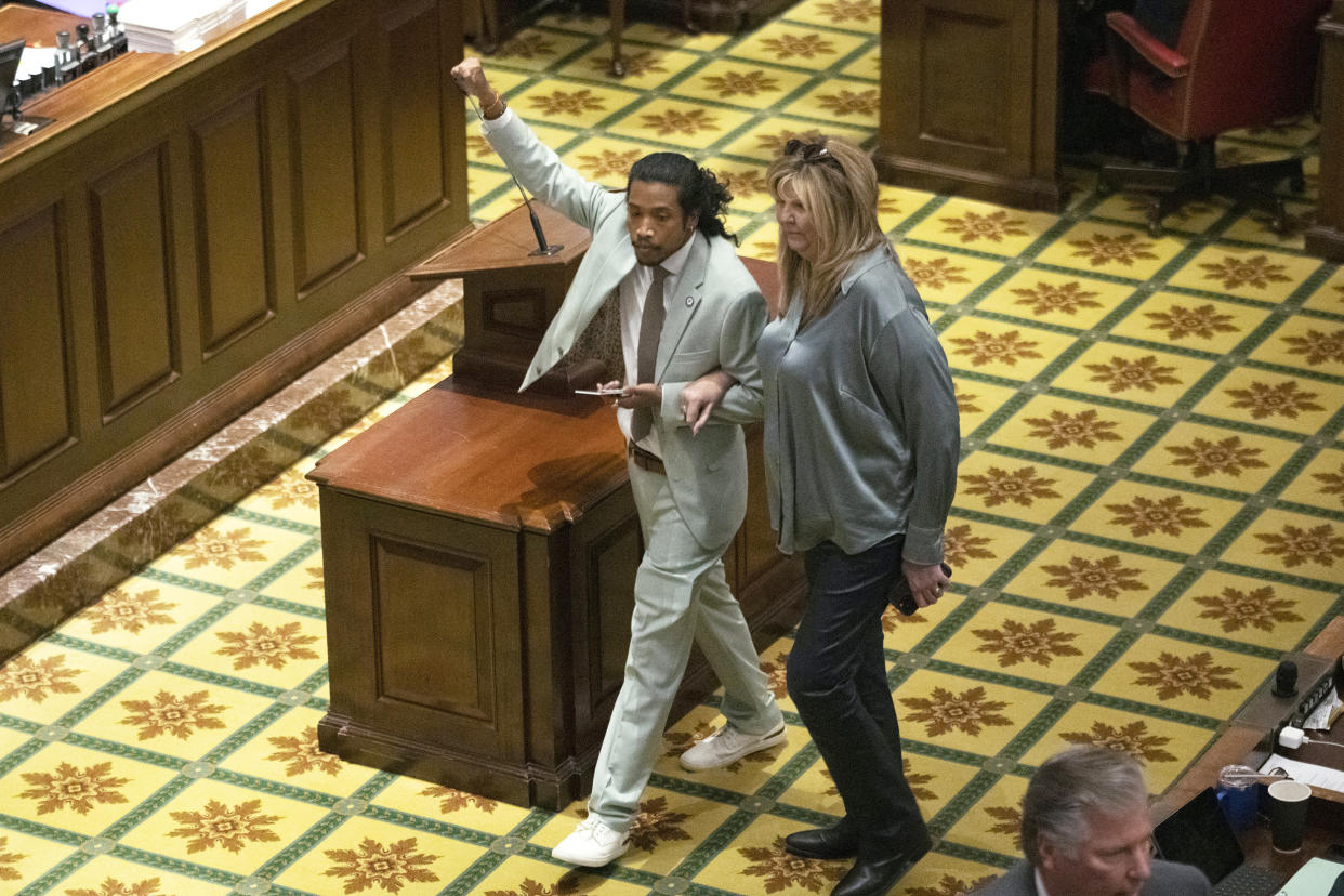 Rep. Justin Jones, D-Nashville, walks into the House chamber with Rep. Gloria Johnson, D-Knoxville, Monday, April 10, 2023, in Nashville, Tenn. Jones was appointed to represent District 52 by the Metro Nashville City Council earlier in the day after being expelled the previous week for using a bullhorn to shout support for pro-gun control protesters in the House chamber.  (George Walker IV / AP)