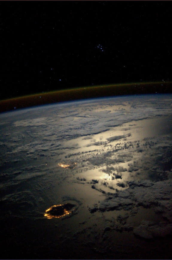 Astronaut Karen Nyberg tweeted a photo of the Seven Sisters (Pleiades) overlooking Reunion and Mauritius islands in the Indian Ocean, taken aboard the International Space Station. Photo dated August 25, 2013.