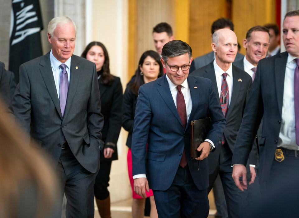 Speaker of the House Mike Johnson, R-La., (center) walks through the Capitol Rotunda with Senators Ron Johnson, R-Wis., left, and Rick Scott, R-Fla., right, heading to a meeting with Senators on Wednesday, Nov. 1, 2023.