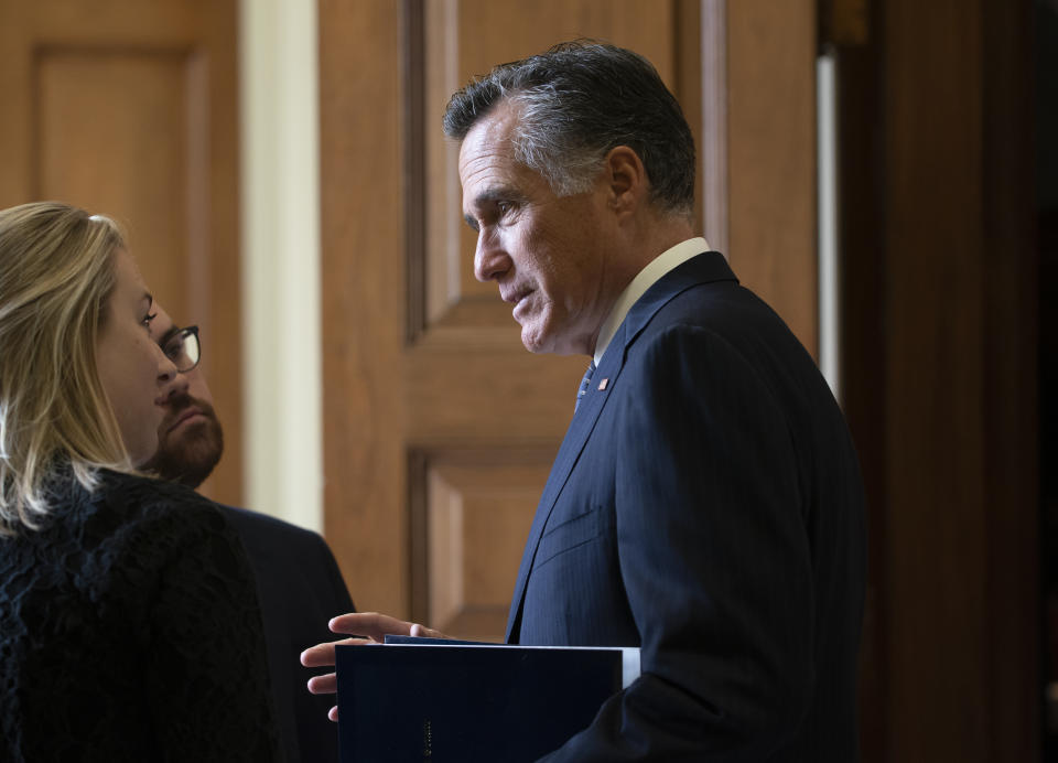 Sen. Mitt Romney, R-Utah, arrives at the Senate for a Republican lunch before work resumes in the impeachment trial of President Donald Trump on charges of abuse of power and obstruction of Congress, in Washington, Friday, Jan. 24, 2020. (AP Photo/J. Scott Applewhite)