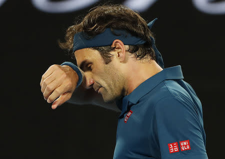 Tennis - Australian Open - Fourth Round - Melbourne Park, Melbourne, Australia, January 20, 2019. Switzerland’s Roger Federer reacts during the match against Greece’s Stefanos Tsitsipas. REUTERS/Adnan Abidi