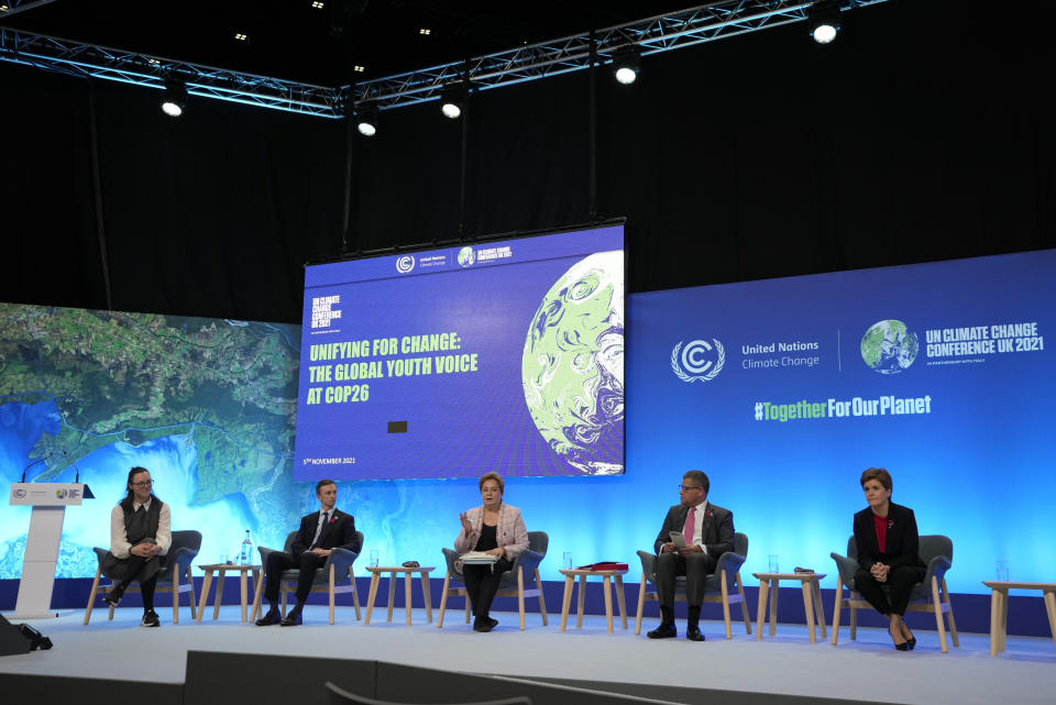 Scotland's First Minister Nicola Sturgeon, right, Alok Sharma President of the COP26 summit, second right, and Patricia Espinosa, UNFCCC Executive-Secretary, center, attend a meeting at the COP26 U.N. Climate Summit in Glasgow, Scotland, Friday, Nov. 5, 2021. The U.N. climate summit in Glasgow gathers leaders from around the world, in Scotland's biggest city, to lay out their vision for addressing the common challenge of global warming. (AP Photo/Alastair Grant)