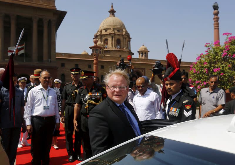 FILE PHOTO: Swedish Defence Minister Peter Hultqvist (C) leaves after a ceremonial reception in New Delhi