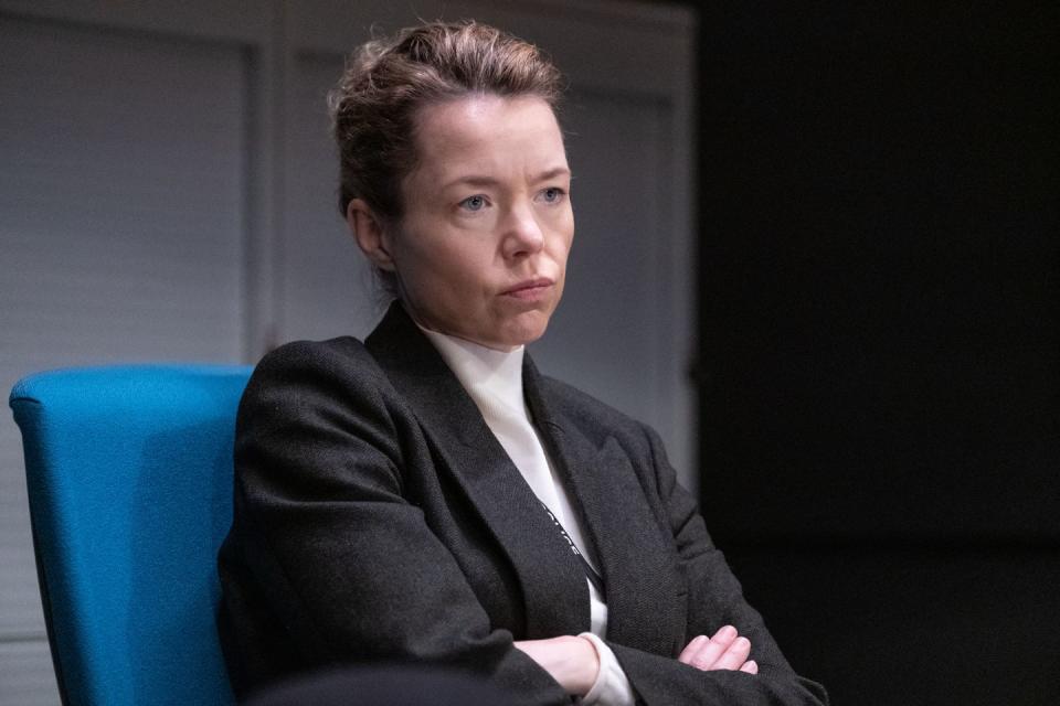 carmichael played by anna maxwell martin in line of duty, sitting down cross armed and frowning