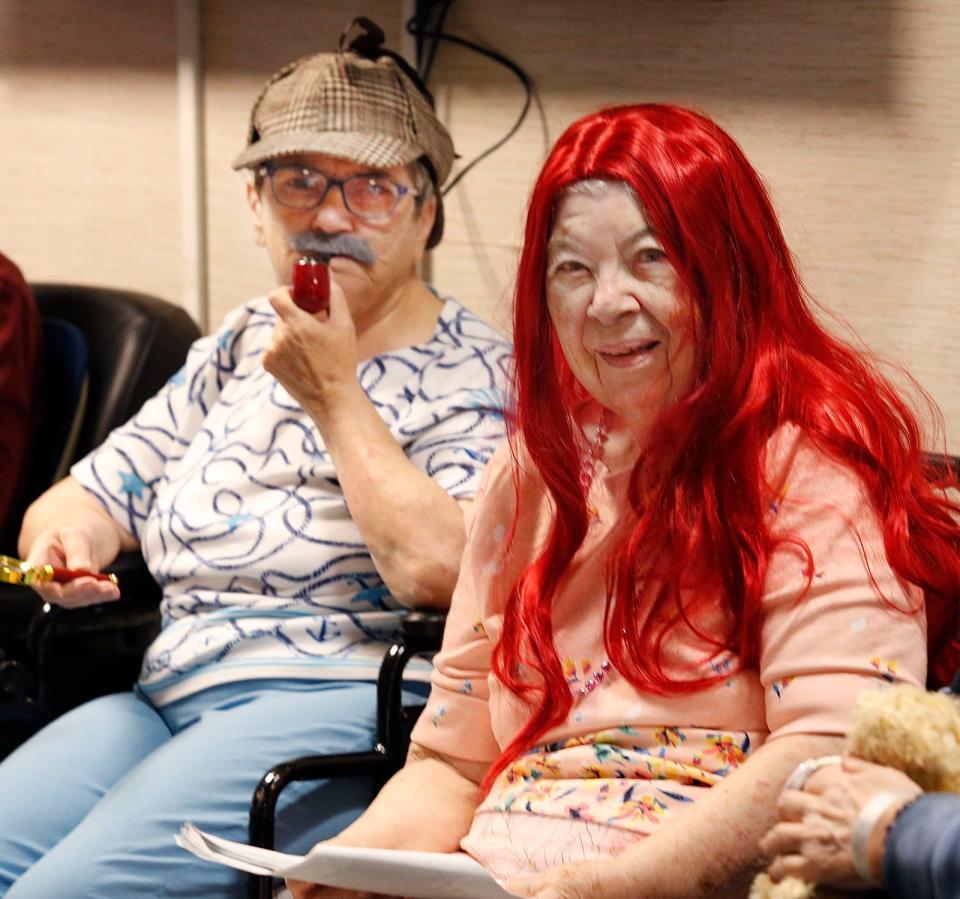 Sandra Morrison as "Detective Cloak Dagger" and Katherine Kelble as the red-headed "Evelina the Mermaid" in "The Shadow of Peter Pan" at Alliance Health at Marina Bay in Quincy.