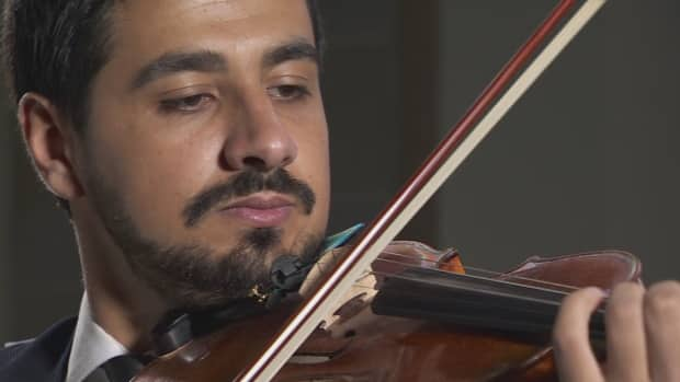 Sari Alesh, a Syrian refugee and violinist, is reviving his musical career in his new home in Victoria. 