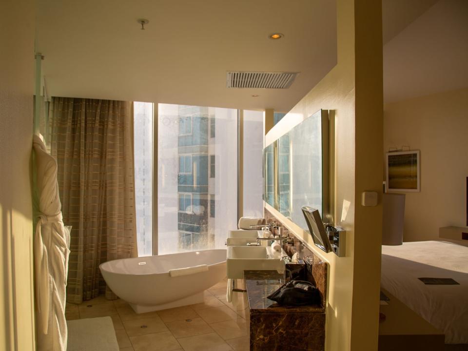 The open concept bathroom in the author's hotel room.