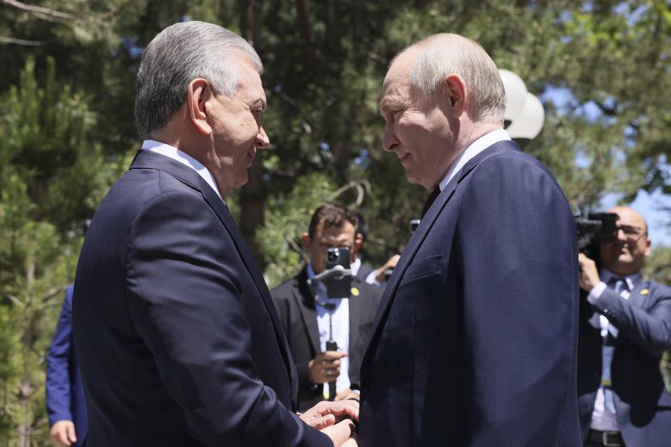 Uzbek President Shavkat Mirziyoyev, left, and Russian President Vladimir Putin shake hands prior to their talks at the Kuksaroy Presidential Palace in Tashkent, Uzbekistan, Monday, May 27, 2024. (Mikhail Metzel, Sputnik, Kremlin Pool Photo via AP)