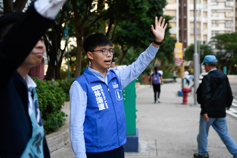 Joshua Wong campaigns for Kelvin Lam, a candidate in Sunday’s district council elections in Hong Kong