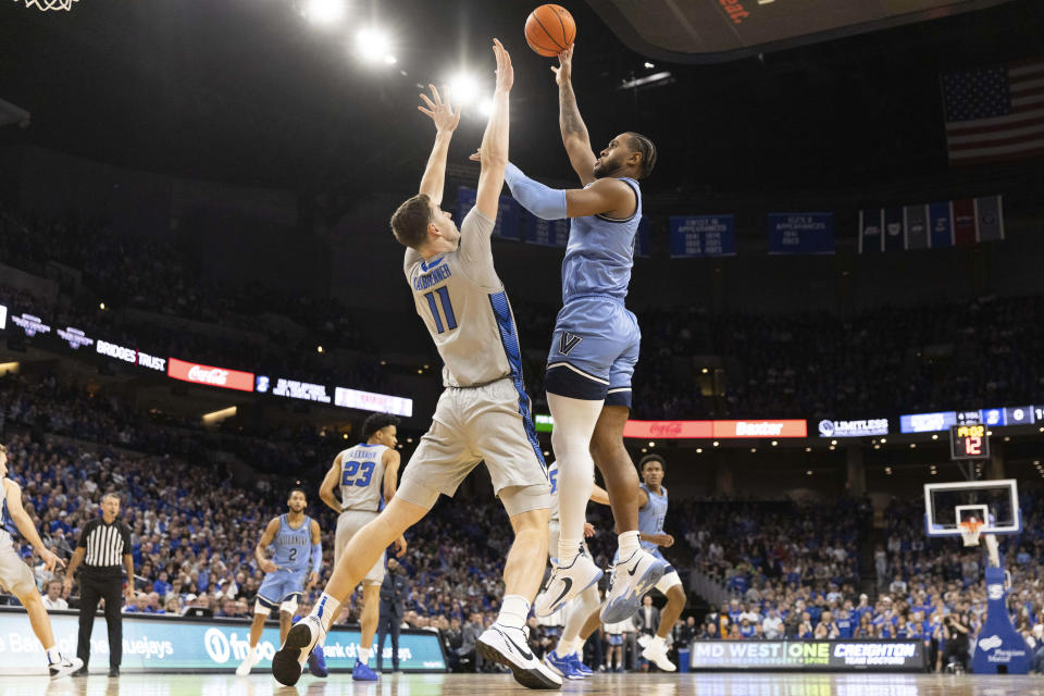 Villanova's Eric Dixon, right, shoots against Creighton's Ryan Kalkbrenner during the first half of an NCAA college basketball game Wednesday, Dec. 20, 2023, in Omaha, Neb. (AP Photo/Rebecca S. Gratz)