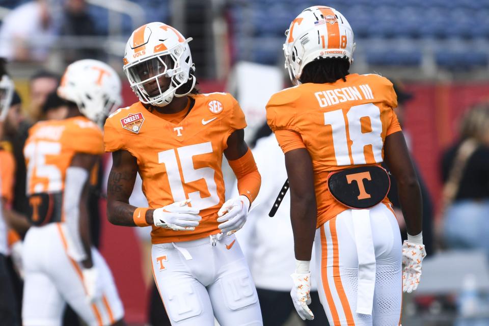 Tennessee defensive backs Cristian Conyer (15) and Rickey Gibson III (18) warming up for the Citrus Bowl NCAA College football game on Monday, January 1, 2024 in Orlando, Fla.