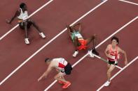 Tatsuhiko Ito, of Japan, reacts after running in the men's 10,000-meter finals at the 2020 Summer Olympics, Friday, July 30, 2021, in Tokyo. (AP Photo/Morry Gash)