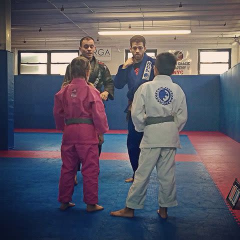 <p>Anthony Bourdain Instagram</p> Ariane Busia-Bourdain and a friend training in martial arts.