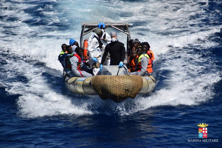 Migrants pictured after being rescued off the coast of Sicily by the Italian Navy on April 11, 2016