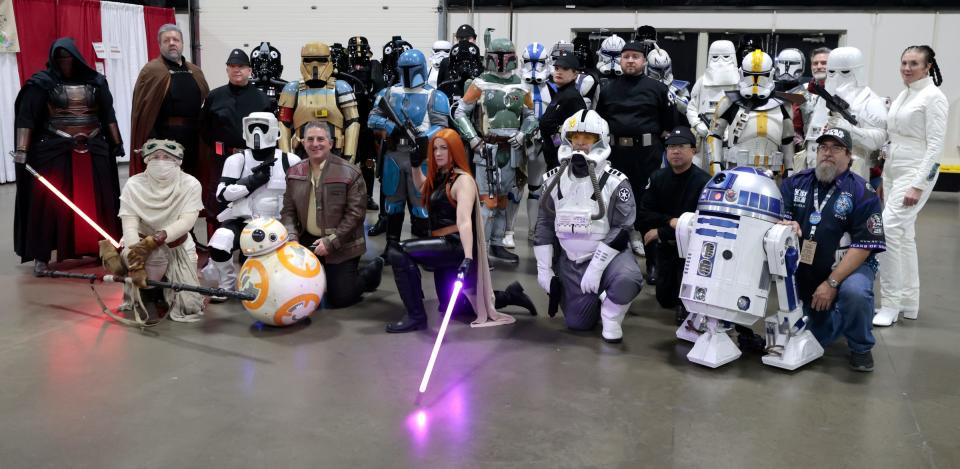 Members of the 501st Legion Great Lakes Garrison made up of various Star Wars characters get together for a group picture during the Motor City Comic Con at the Suburban Collection Showplace in Novi on Saturday, November 11, 2023.