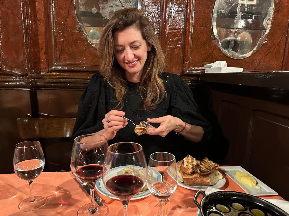 Author Kasia Dietz eating escargot at Chez L'Ami Louis