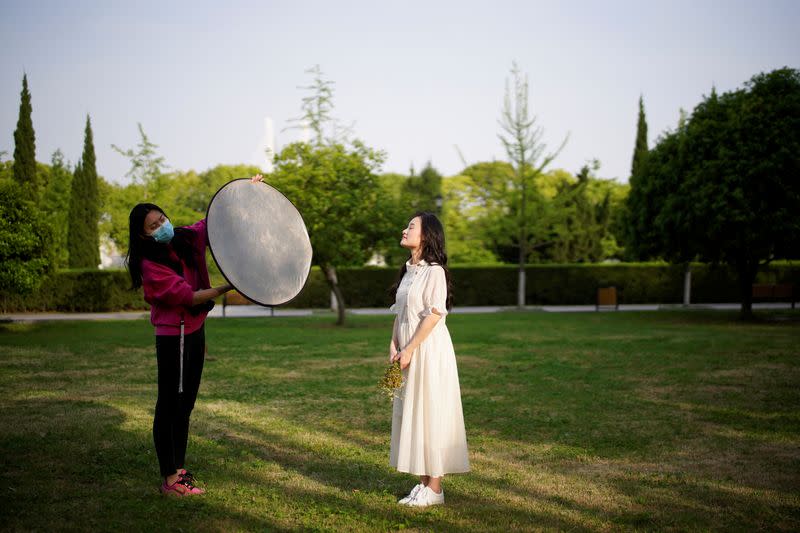 Peng Jing, 24, poses for her wedding photography shoot after the lockdown was lifted in Wuhan