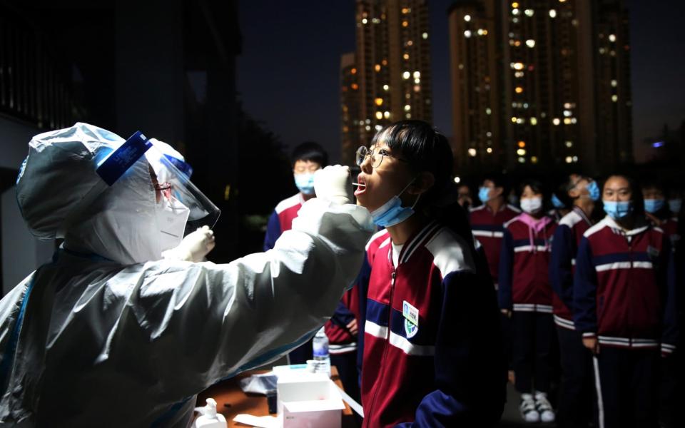 A mass testing programme was quickly rolled out following an outbreak in Qingdao - Reuters 