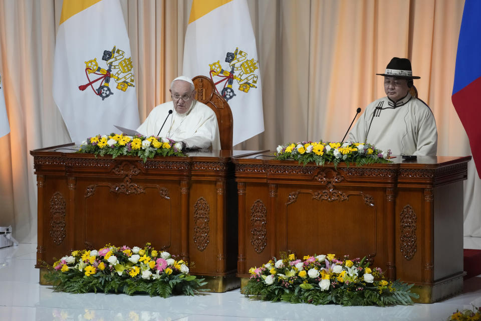 Mongolian President Ukhnaagin Khurelsukh, right, and Pope Francis, Saturday, Sept. 2, 2023, attend a meeting with Mongolian authorities in the Ikh Mongol Hall of the Saaral Ordon Presidential Palace in Ulaanbaatar. Pope Francis arrived in Mongolia on Friday morning for a four-day visit to encourage one of the world's smallest and newest Catholic communities. (AP Photo/Andrew Medichini)