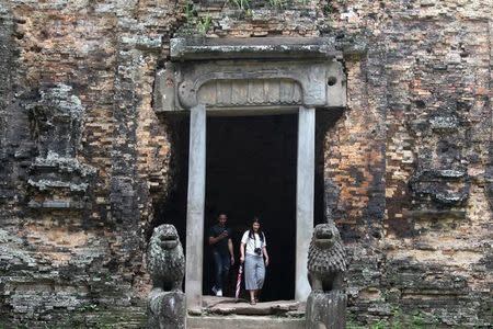 Tourist visit Sambor Prei Kuk, or "the temple in the richness of the forest" an archaeological site of ancient Ishanapura, is seen after being listed as a UNESCO world heritage site, in Kampong Thom province, Cambodia July 15, 2017. Picture taken July 15, 2017. REUTERS/Samrang Pring