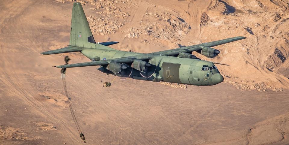 A C-130J, carrying a total of 80 paratroopers, delivers the soldiers during an exercise in Jordan. <em>Crown Copyright</em><br>