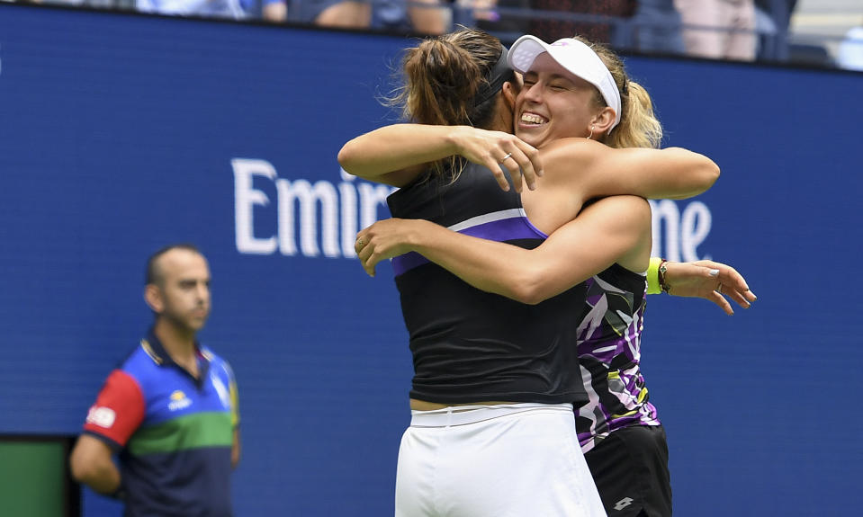 Elise Mertens, of Belgium, right, celebrates with doubles partner Arena Sabalenka, of Belarus, after winning the women's doubles final against Victoria Azarenka, of Belarus, and Ashleigh Barty, of Australia, at the U.S. Open tennis championships Sunday, Sept. 8, 2019, in New York. (AP Photo/Sarah Stier)