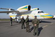 Ukrainian medical personnel depart for coronavirus-hit Italy at an airport in Kiev