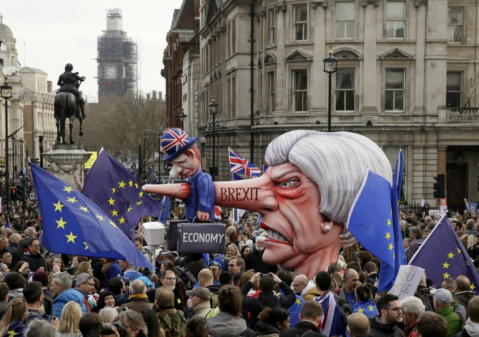 An effigy of British Prime Minister Theresa May is wheeled through Trafalgar Square during a Peoples Vote anti-Brexit march in London, Saturday, March 23, 2019. The march, organized by the People's Vote campaign is calling for a final vote on any proposed Brexit deal. This week the EU has granted Britain's Prime Minister Theresa May a delay to the Brexit process. (AP Photo/Tim Ireland)