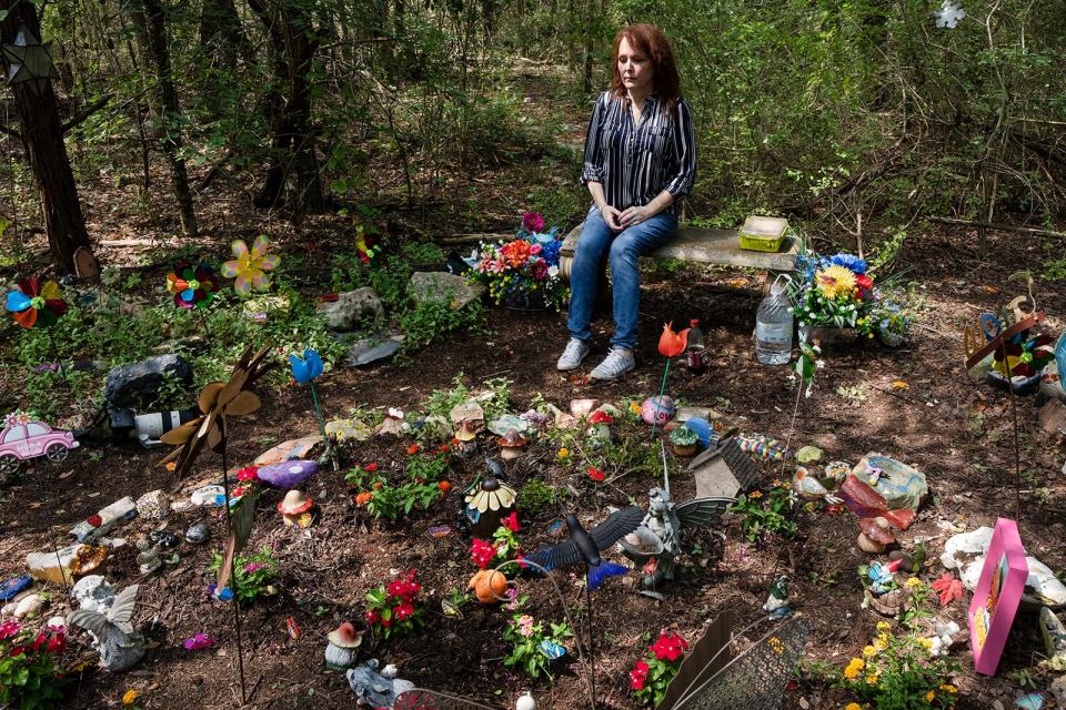 Elizabeth Crecente sits in Jennifer's Garden Friday, June 23, 2023. Jennifer Crecente, Elizabeth's daughter, was killed in 2006 by her ex-boyfriend. Since then, Elizabeth has transformed the space Jennifer was murdered into a colorful garden that honors her life.