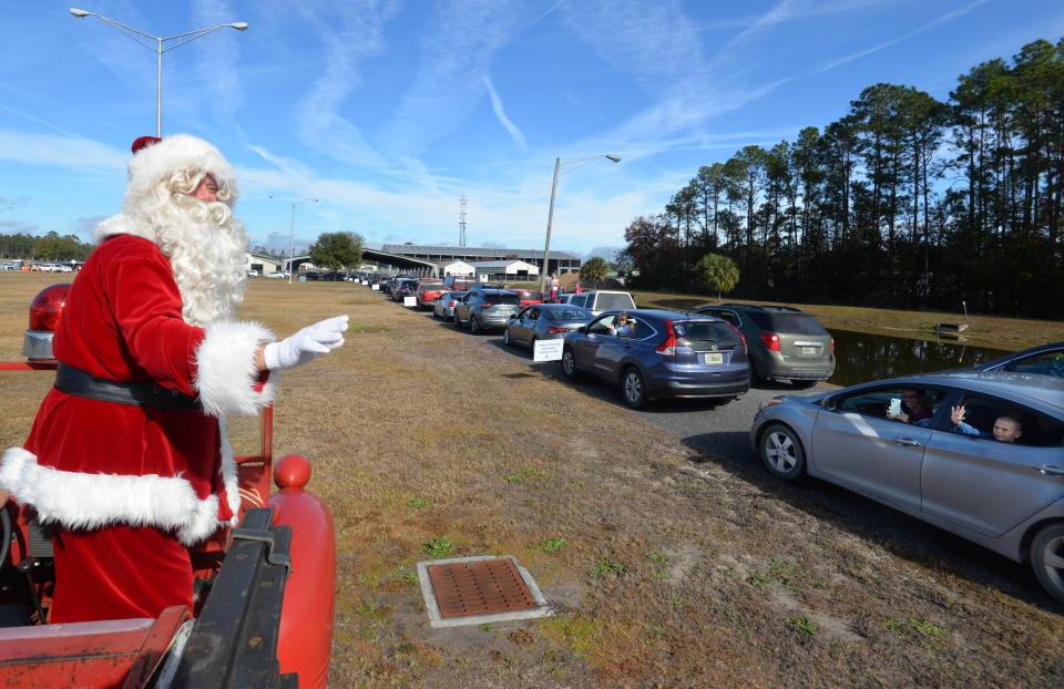 In 2020 Santa came to the Clay County Fairgrounds on a firetruck to welcome families to 39th annual J.P. Hall Christmas Party. Hundreds of gifts were given to families as they stayed in cars because of the COVID-19 pandemic.