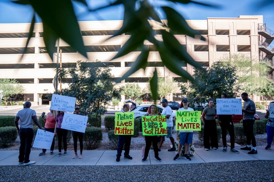 People attend a rally outside the Arizona Department of Health Services in Phoenix on Sept. 26, 2023.