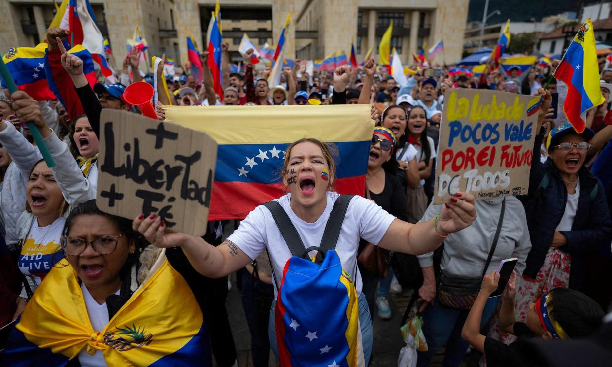 <span>Demonstrators protest against Venezuelan President Nicolás Maduro's disputed victory in Bogota. Maduro has vowed to ‘pulverise’ challenge to his rule.</span><span>Photograph: Luis Acosta/AFP/Getty Images</span>