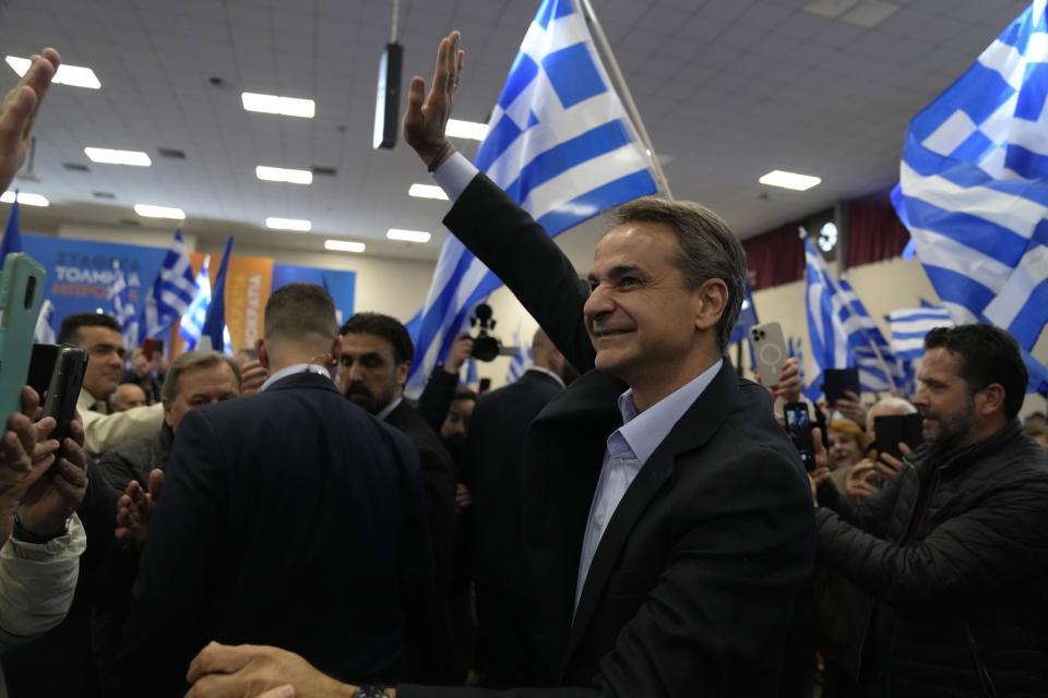 Greece's Prime Minister and New Democracy leader Kyriakos Mitsotakis waves to his supporters during an election rally, in Volos, central Greece, Thursday, May 11, 2023. Greeks go to the polls Sunday, May 21, in the first general election held since the country ended successive international bailout programs and strict surveillance period imposed by European leaders. Conservative Prime Minister Kyriakos Mitsotakis is seeking a second four-year term and is leading in opinions but may need a coalition partner to form the next government. (AP Photo/Thanassis Stavrakis)