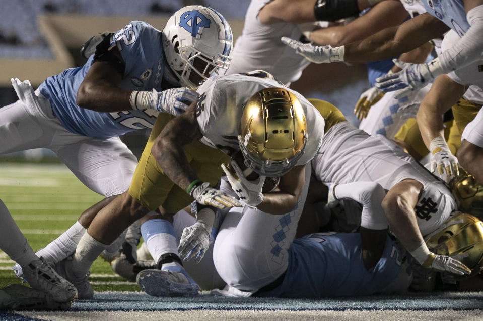 Notre Dame's Kyren Williams (23) scores on a one-yard against North Carolina during an NCAA college football game, Friday, Nov. 27, 2020, at Kenan Stadium in Chapel Hill, N.C. (Robert Willett/The News & Observer via AP)