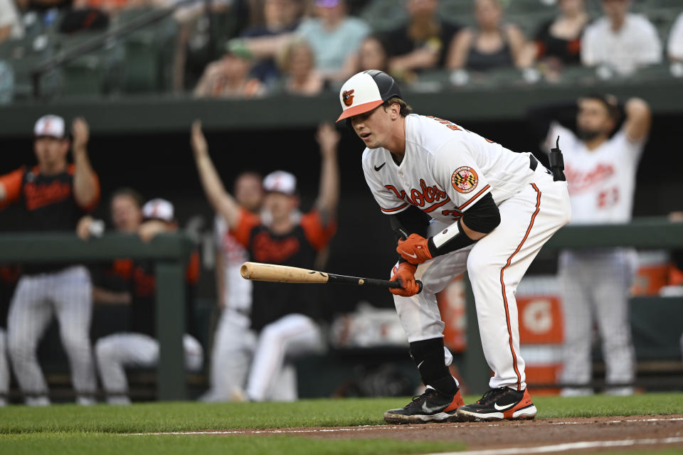 Baltimore Orioles' Adley Rutschman reacts after a called third strike on a check swing against the Seattle Mariners in the first inning of a baseball game Tuesday, May 31, 2022, in Baltimore. (AP Photo/Gail Burton)