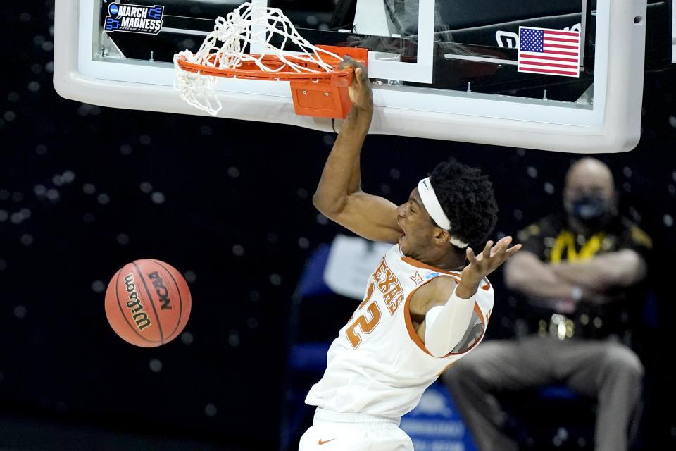 FILE - In this March 20, 2021, file photo, Texas' Kai Jones dunks against Abilene Christian during the first half of a college basketball game in the first round of the NCAA tournament at Lucas Oil Stadium in Indianapolis. Jones is a first-round prospect in this year's NBA draft. (AP Photo/Mark Humphrey, File)