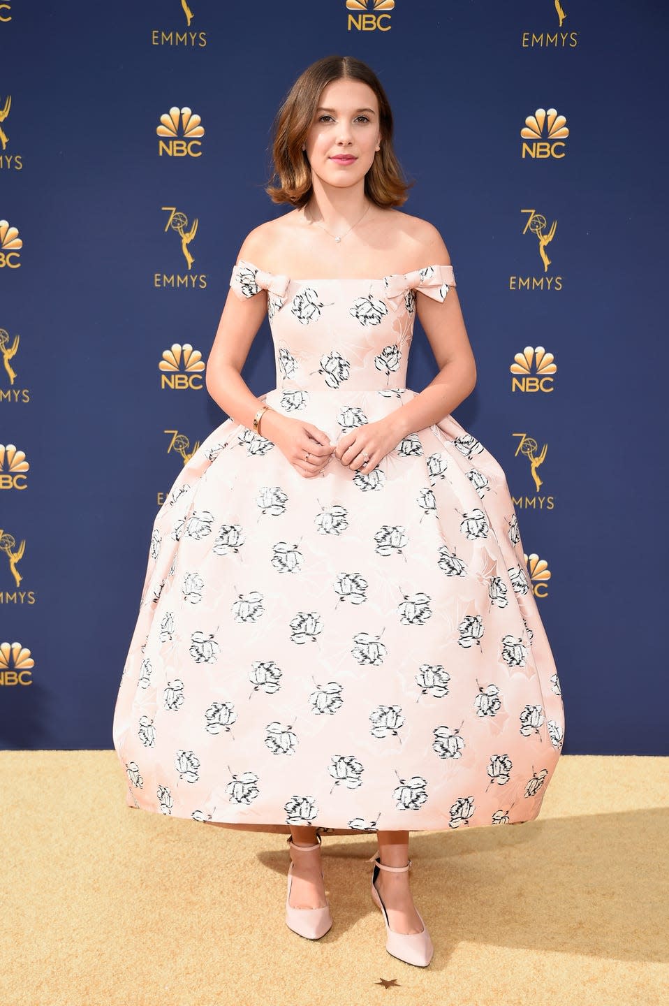 <p>For the September 2018 Emmy red carpet, Millie wore a bardot Calvin Klein floral dress.</p>