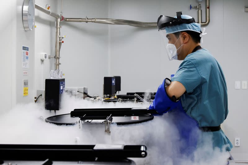 An employee checks a bio tank that freezes eggs in a Fertility Research lab at Cha Fertility Center in Bundang