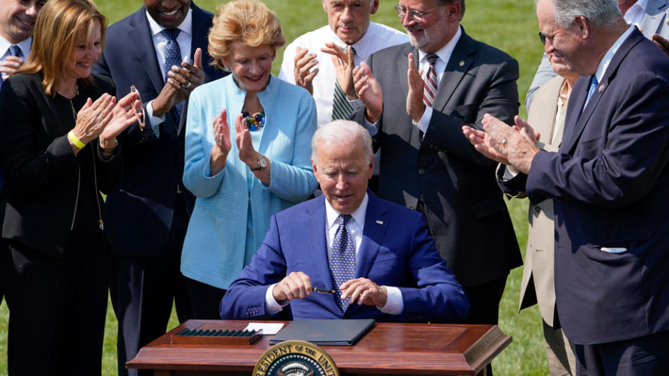 US President Joe Biden signs an executive order for the increased production of electric vehicles. - Credit: Photo by Susan Walsh/AP Photo.